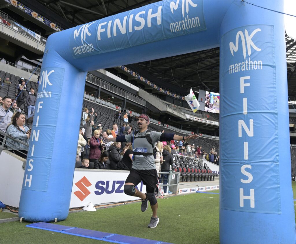 Ahmad at the finish line of the marathon.